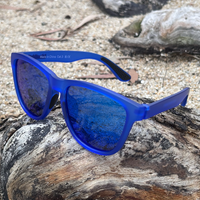 Blue Drifter Floating Sunglasses On Beach